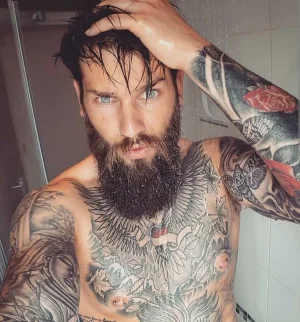 man-with-tattoos-and-beard_1079x.webp